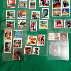 31 postage stamp collection - Beatles, Malcolm X, Roger Maris, Ford Mustang, etc